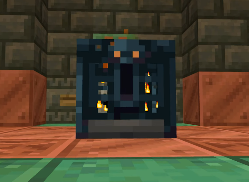 A cage looking block called the vault with a large keyhole on the side. On top of the keyhole sits a skull with orange eyes.